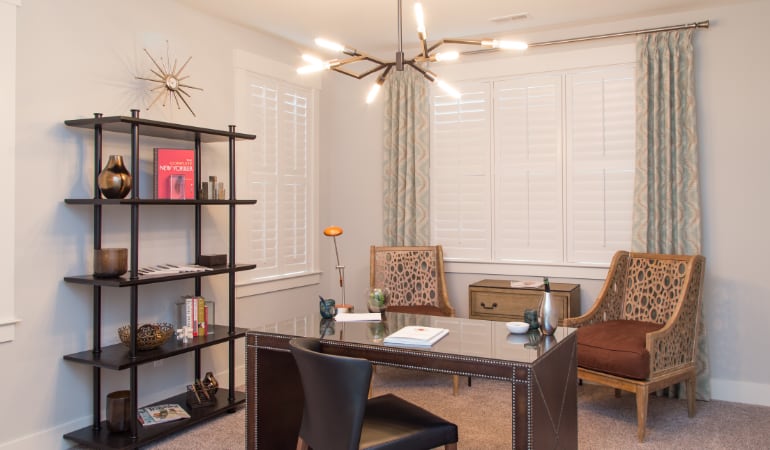 Minneapolis home office with plantation shutters.